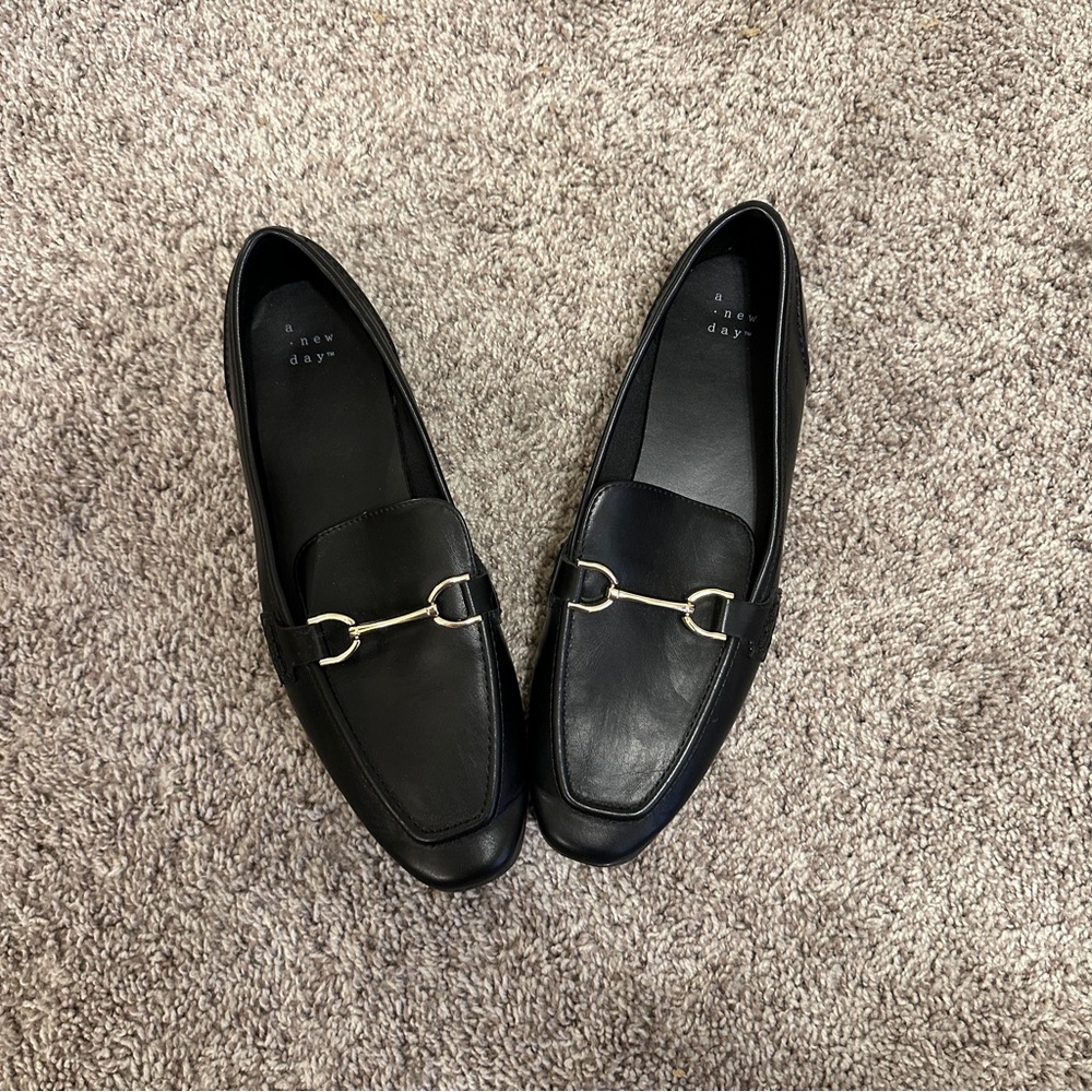 NWOT A new day black loafers with gold. Absolutely no flaws never worn.